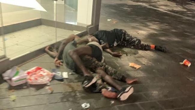 Drunken itinerants lie passed out in the Cairns CBD in 2019. Picture: Supplied