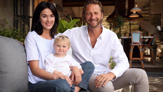 Justin Hemmes pictured with partner Kate and daughter Alexa at his home in Vaucluse.