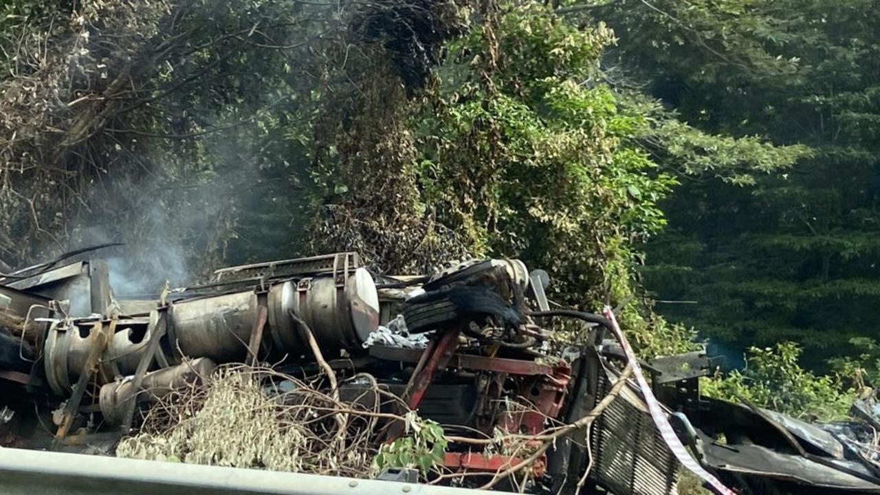 Truck catches fire after crashing into highway guardrail
