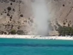 Unsuspecting beachgoers have been caught in a chaotic wind tunnel at a popular summer swim spot. Nine News.