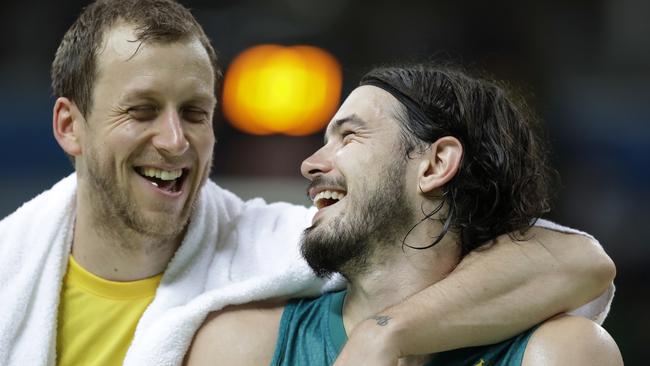 Australia's Joe Ingles, left, laughs with teammate Chris Goulding after a basketball game against Venezuela at the 2016 Summer Olympics in Rio de Janeiro, Brazil, Sunday, Aug. 14, 2016. (AP Photo/Charlie Neibergall)