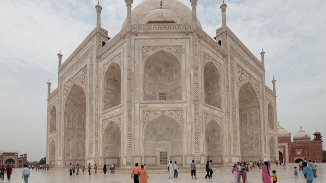 Visitors are dwarfed by the Taj Mahal in Agra.