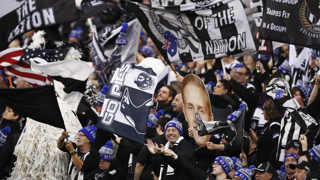 Magpies fans cheering during the Queen’s Birthday win over Melbourne. (AAP Image/Daniel Pockett)