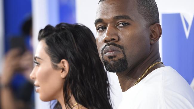 FILE - In this Aug. 28, 2016 file photo, Kim Kardashian West, left, and Kanye West arrive at the MTV Video Music Awards in New York. Kanye West will visit the White House on Thursday to meet with President Donald Trump and his son-in-law Jared Kushner talk about manufacturing in America, gang violence, prison reform and Chicago violence. (Photo by Evan Agostini/Invision/AP, File)