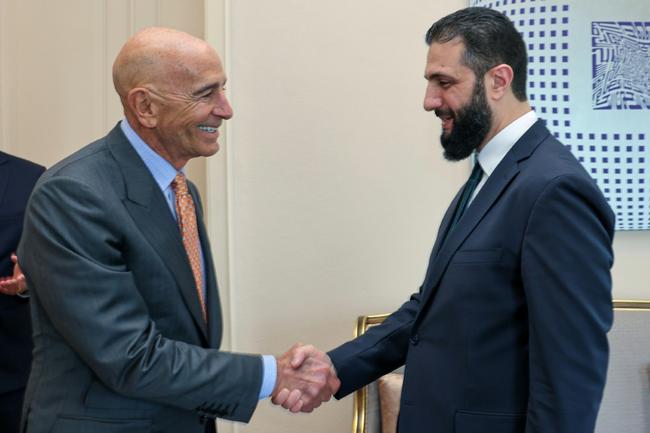 A photograph released by the Turkish foreign ministry on May 24, 2025 shows US Syria envoy Tom Barrack shaking hands with Syria's jihadist-turned-interim President Ahmed al-Sharaa during a meeting in Istanbul