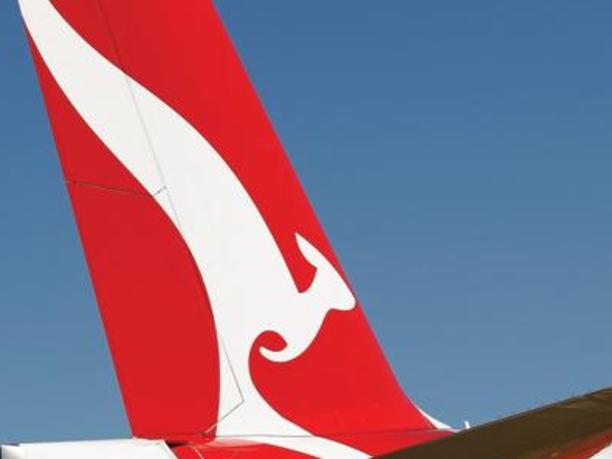 06/09/2012 BUSINESS: The Qantas Airways Ltd. logo is displayed on the tail of an aircraft during a media event in Sydney, Australia, on Thursday, Sept. 6, 2012. Qantas formed an alliance with Emirates Airline to coordinate prices and schedules, while scrapping a similar deal with British Airways, as the carrier tries to reverse losses on long-haul routes. Photographer: Brendon Thorne/Bloomberg
