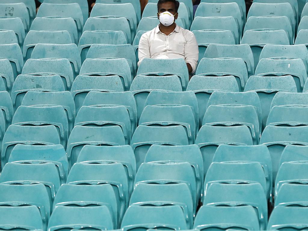 A spectator wearing a face mask looks on during the ICC Women's T20 Cricket World Cup Semi-Final match between Australia and South Africa at the Sydney Cricket Ground. Picture: Ryan Pierse/Getty Images