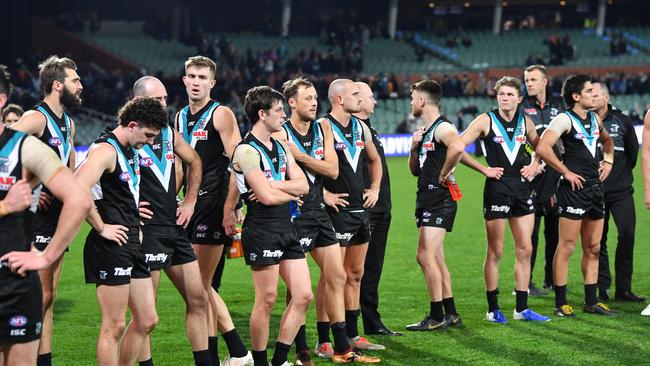 The Power players commiserate after their loss to Essendon in last year’s final minor round game. They will wrap up the home and away season when they host Fremantle at Adelaide Oval. Picture: AAP Image/David Mariuz