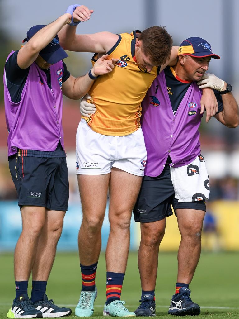 Keane is helped off by trainers after the tackle. Picture: Mark Brake/Getty Images