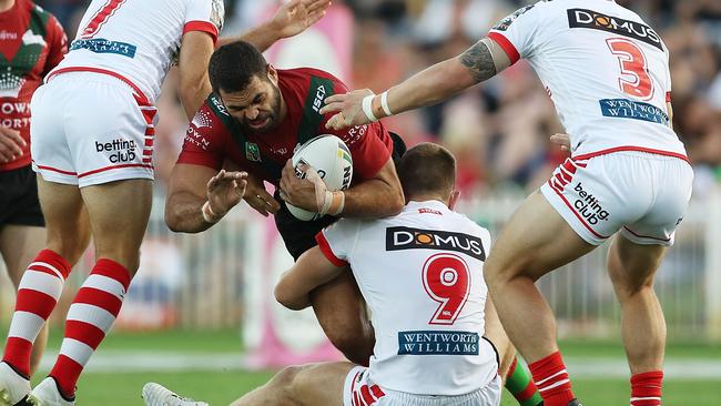 Greg Inglis of the Rabbitohs is tackled.