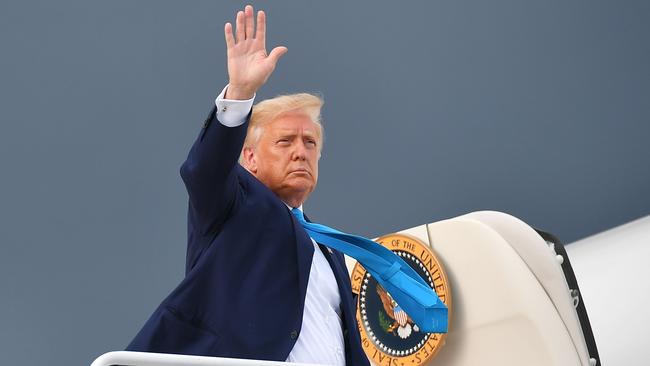 Donald Trump makes his way to board Air Force One before departing from Andrews Air Force Base in Maryland on September 3.