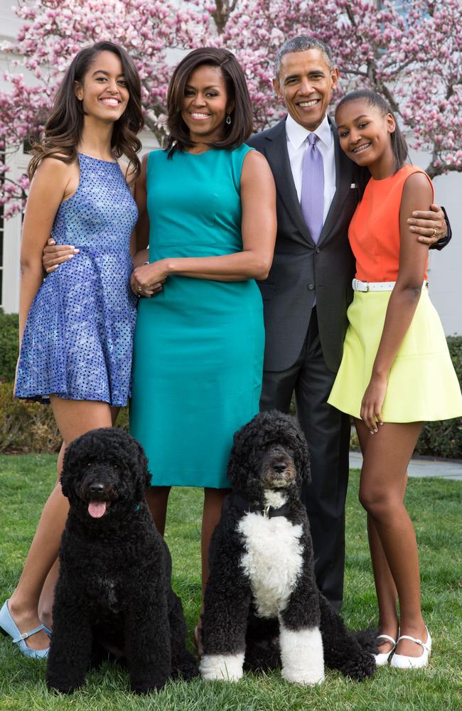 Former US president Barack Obama, Michelle Obama and daughters Malia (L) and Sasha (R). Picture: Getty Images