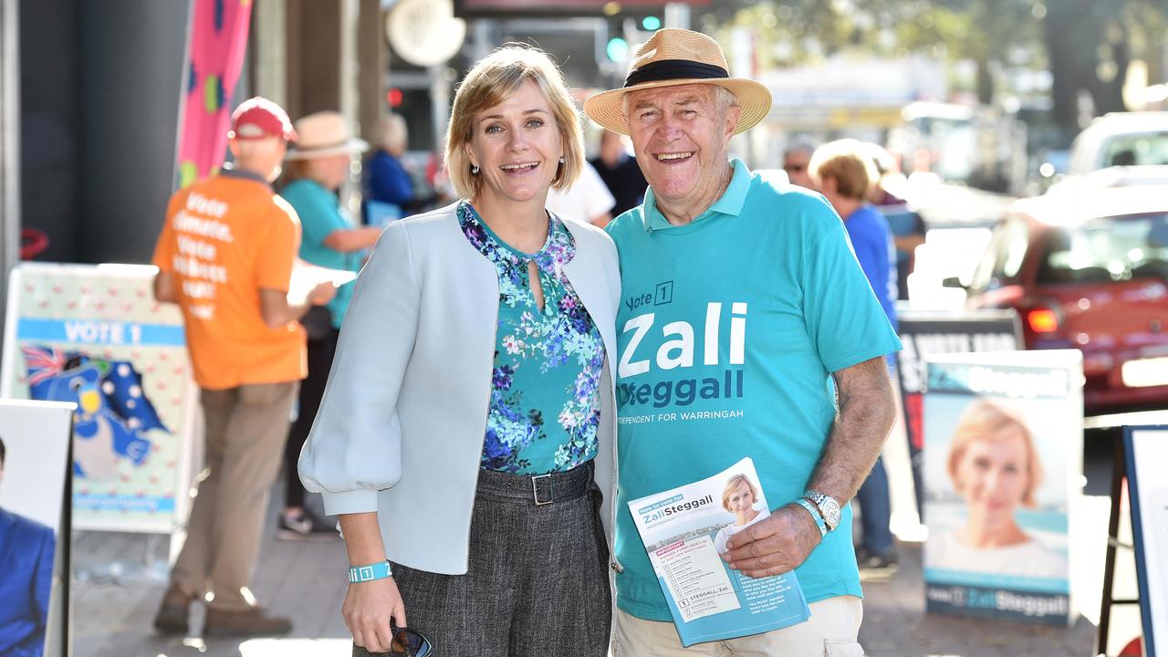 Zali Steggall and her father Jack outside a pre-poll centre at Manly on Thursday. Picture: AAP