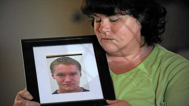 GRIEVING MOTHER: Helen Gordon with a portrait of her son Leonard Gordon who was murdered at the Maryborough Correctional Centre in 2012. Photo: Mike Knott / NewsMail. Picture: Mike Knott BUN071013ANN3