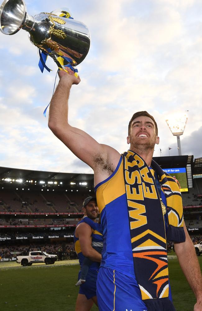 Scott Lycett holds up the premiership cup on grand final day at the MCG this year. Picture: Julian Smith (AAP).