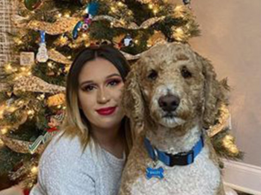 Sarah Simental, seen with her dog Bailey, died December 26, from COVID-19.