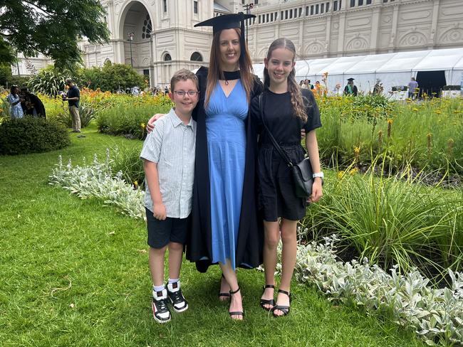 Michael, Kristy Muratore (Master of Education) and Lila at the University of Melbourne graduations held at the Royal Exhibition Building on Saturday, December 14, 2024. Picture: Jack Colantuono