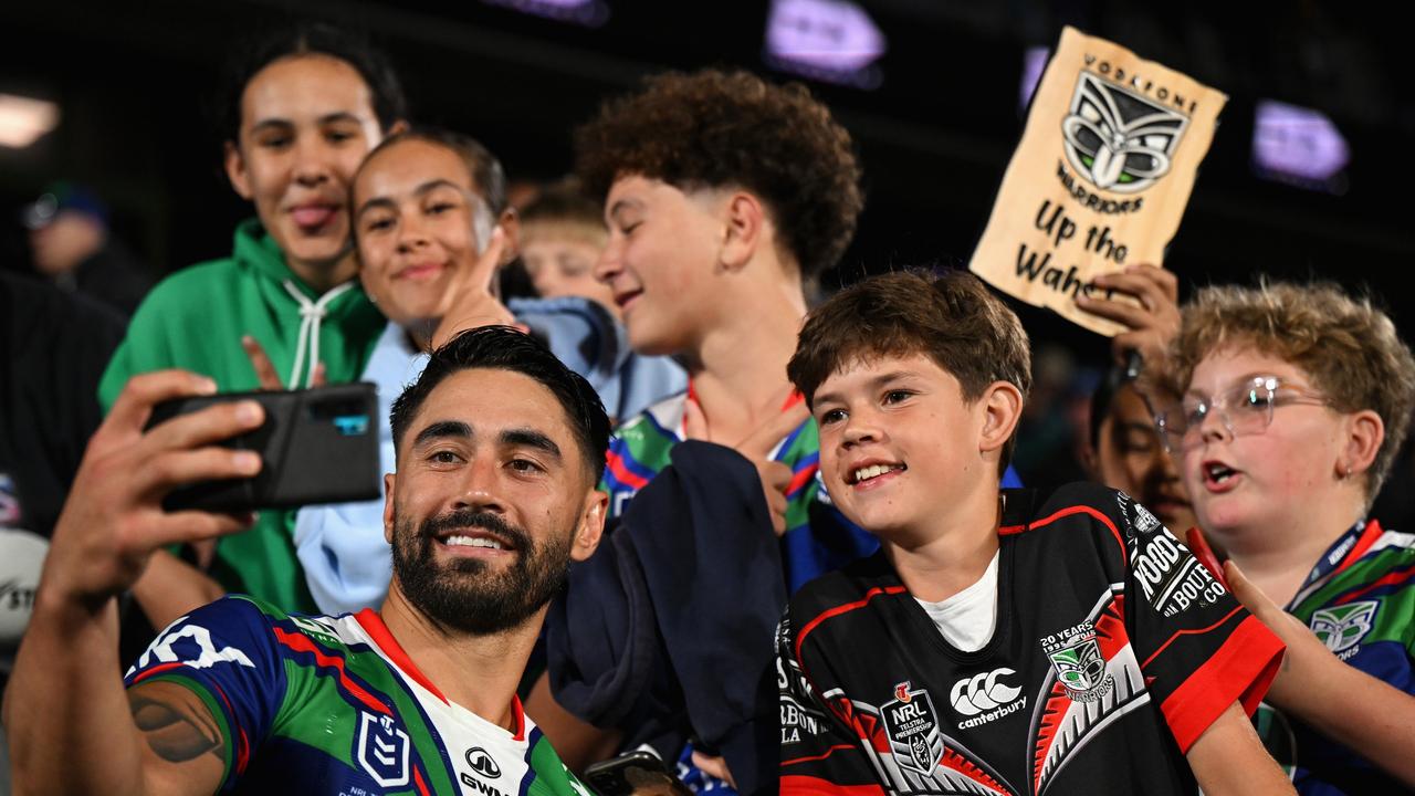 Shaun Johnson with young fans. Photo by Hannah Peters/Getty Images