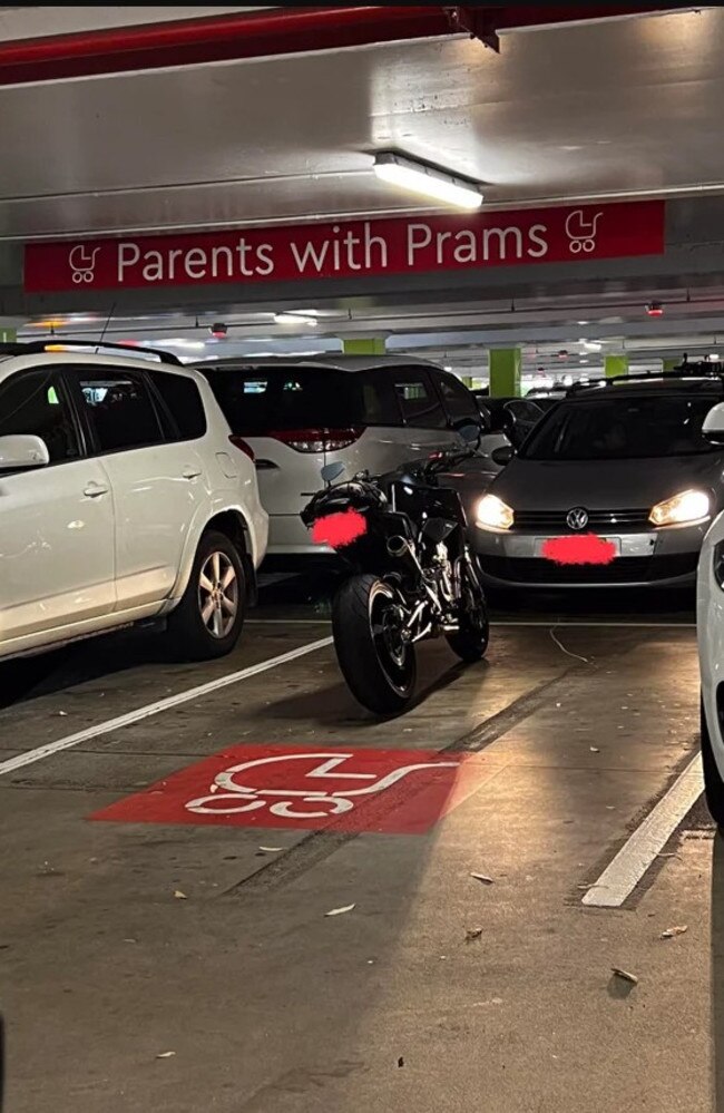 The motorcycle took up an entire parking spot reserved for parents with prams. Picture: Reddit.