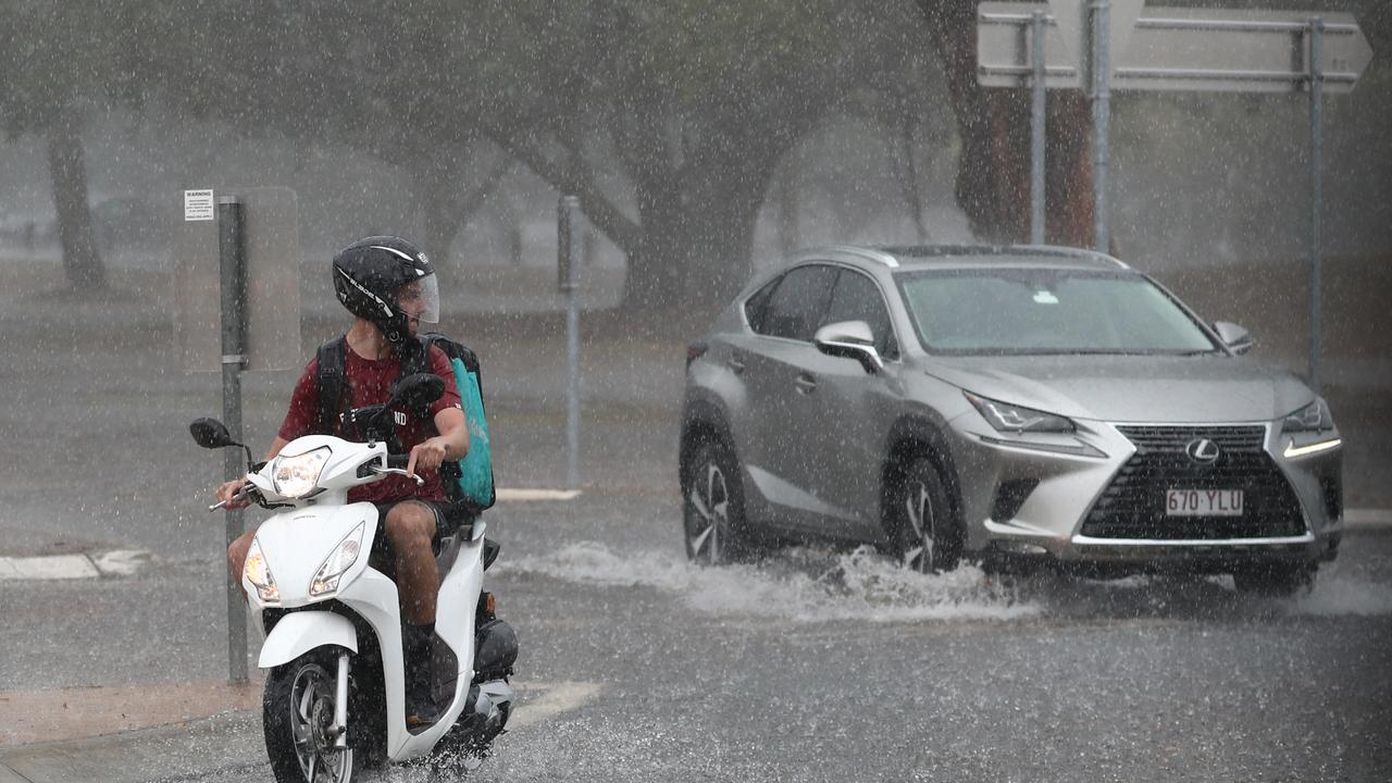 Motorists on Queen St in Southport after a storm lashes the Gold Coast. Photograph : Jason O’Brien