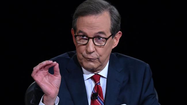 Debate moderator and Fox News anchor Chris Wallace desperately tries to get a word in during the shout-a-thon. Picture: Olivier Douliery/AFP