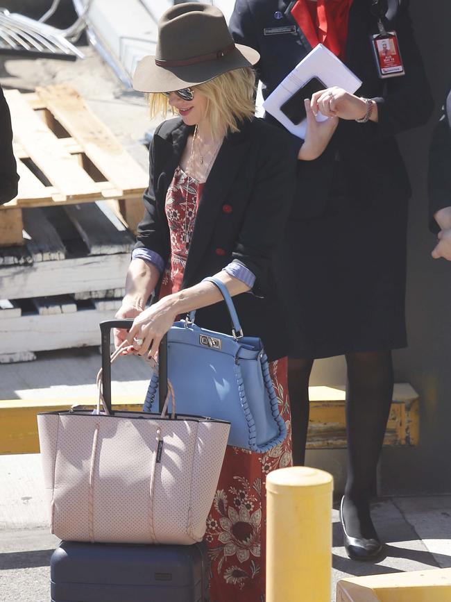 The actress wore a red floral pantsuit, paired with a blazer and akubra-style hat. Picture: Matrix