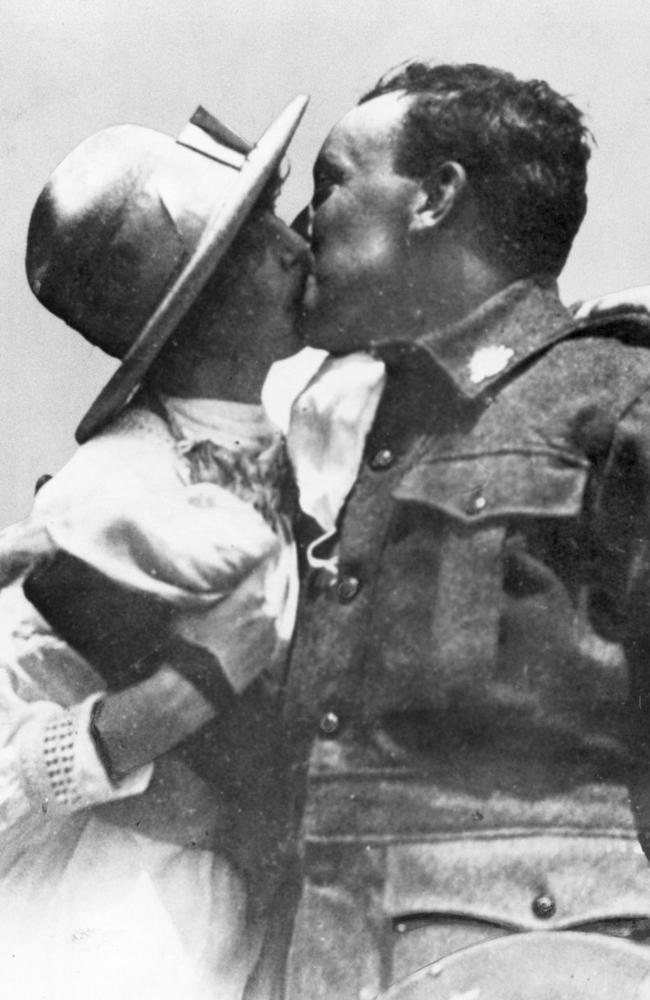 Welcome home … an Australian soldier gets a kiss from his wife as he returns home to Sydney in 1919; but it wasn’t that easy for all couples reunited, or meeting for the first time, after WWI.