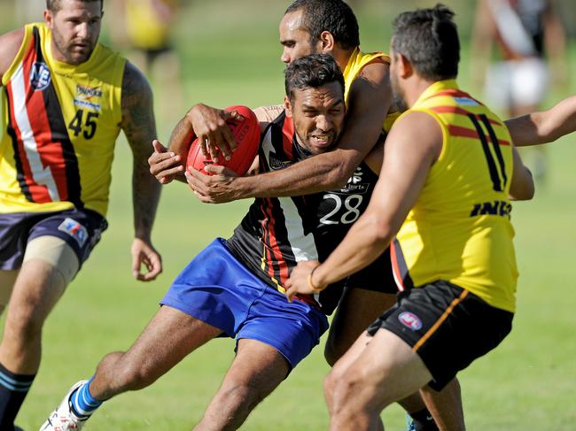 Tyson Carmody is taken high by Ezra Cleary in a Redtails trial match in 2016. Picture: Charlie Lowson