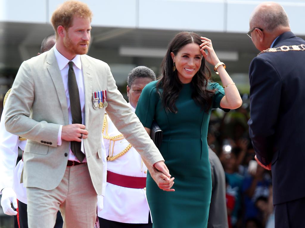 The Duke and Duchess of Sussex Prince Harry and Meghan take part in a traditional fijian ceremony at Nadi Airport in Fiji to . Picture: Nathan Edwards