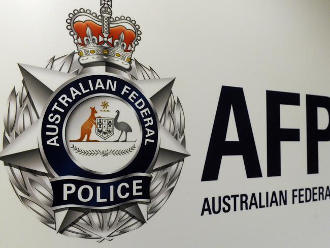 An Australian Federal Police logo is seen in Geelong, Friday, Oct 3, 2014. (AAP Image/Julian Smith) NO ARCHIVING