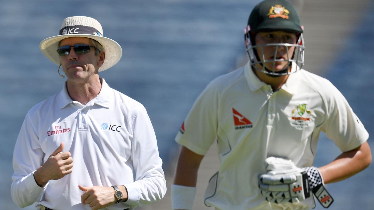 Matthew Renshaw holds his stomach while running back to the pavilion during the first Test in India in 2017.