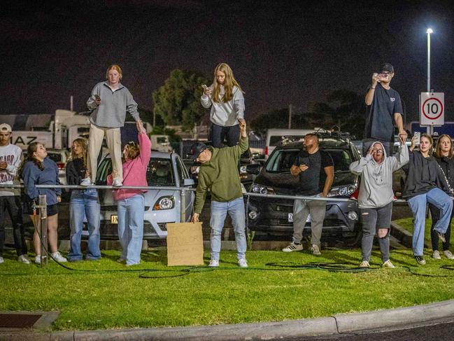 Eager youngsters get into position to catch a glimpse of their idol. Picture: Jake Nowakowski