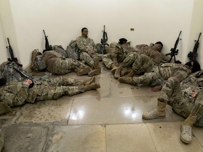 National Guard troops grab some rest in the Capitol. Picture: AFP