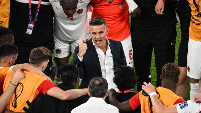 Herdman speaks to his players.