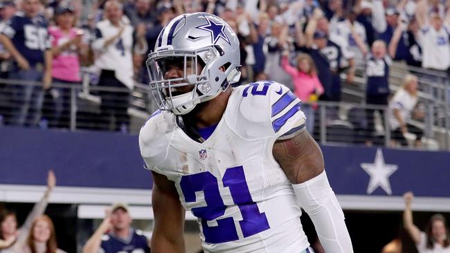 Ezekiel Elliott #21 of the Dallas Cowboys celebrates after scoring a touchdown.