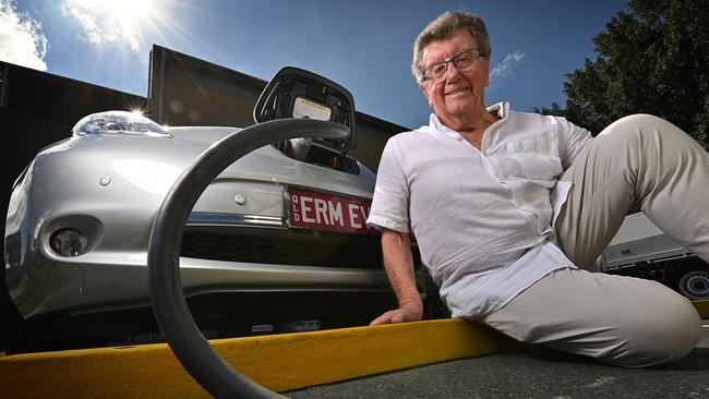 Energy billionaire Trevor St Baker with his Nissan LEAF at one of his company’s charging stations. Picture: Lyndon Mechielsen