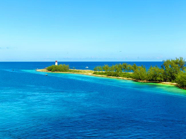 Scenic view of an idyllic beach at Nassau, Bahamas, on Paradise Island. Caribbean and tropical beach scene at Nassau with white sand coastline and deep blue sea, Bahamas. Island of the lighthouse tower.Photo - istockEscape 1 Oct twin share