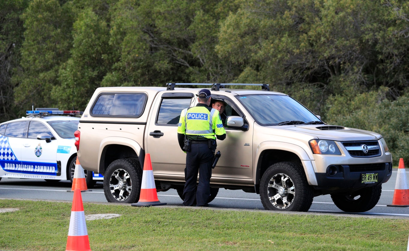 Queensland Police set up a road block due to the Corona Virus at the NSW / Queensland Border on the old Pacific Highway at Coolangatta. Photo: Scott Powick Newscorp