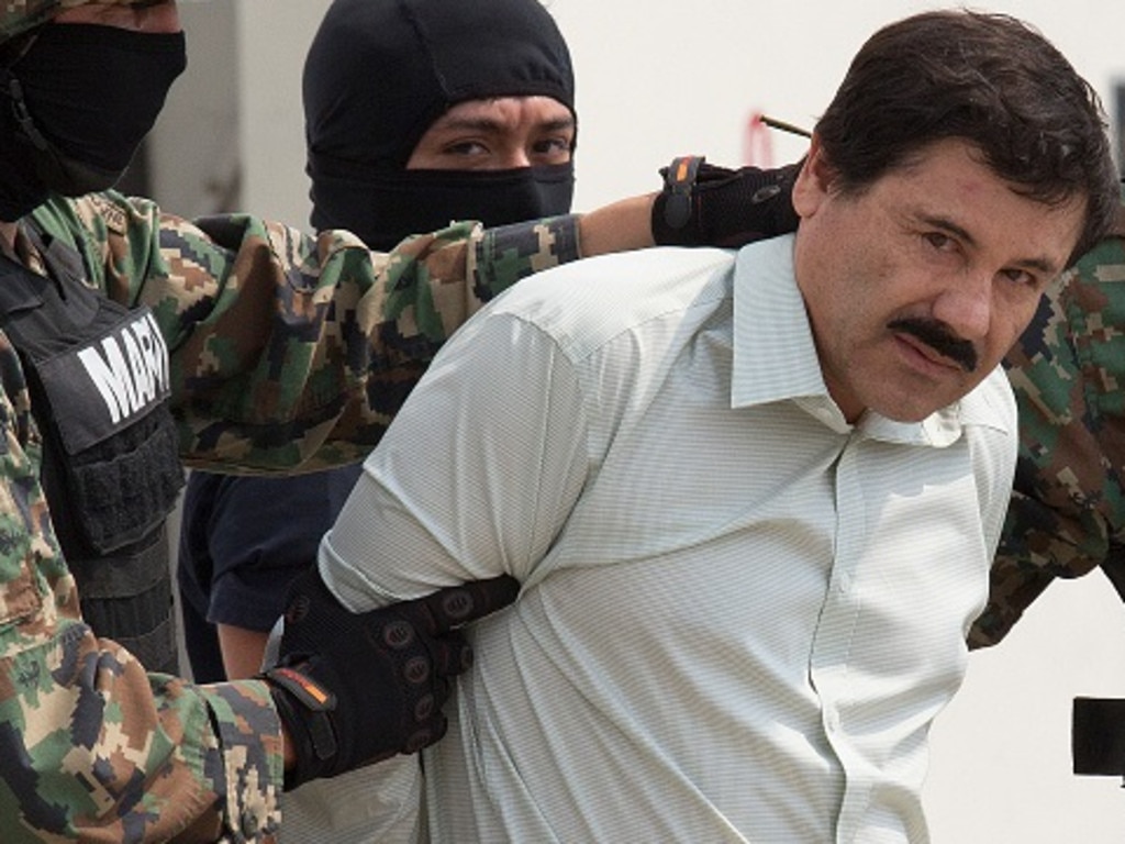 The drug trafficker Joaquin Guzman Loera, El Chapo, looks at the press. Picture: Bloomberg