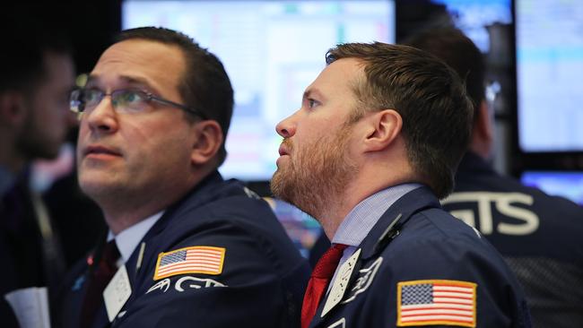 NEW YORK, NY - FEBRUARY 06: Traders work on the floor of the New York Stock Exchange (NYSE) on February 6, 2018 in New York City. Following Monday's over 1000 point drop, the Dow Jones Industrial Average closed up over 500 points.   Spencer Platt/Getty Images/AFP == FOR NEWSPAPERS, INTERNET, TELCOS & TELEVISION USE ONLY ==