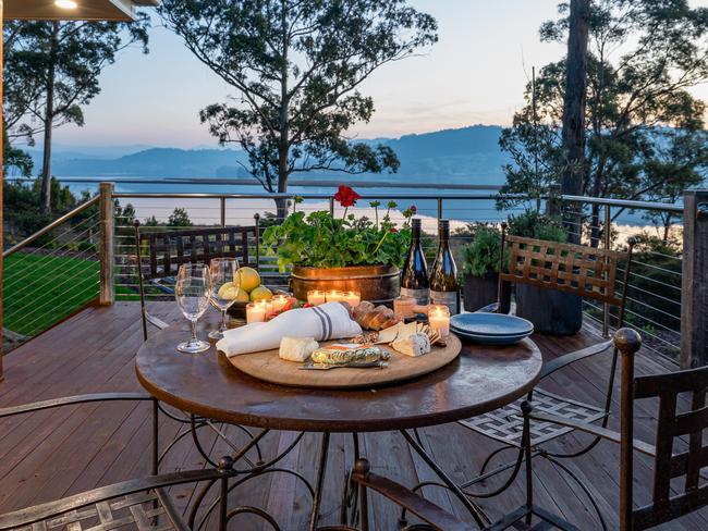 The deck at the Huon River Hideaway is a great spot to indulge in a platter and wine sourced from the host’s daughter’s vineyard Sailor Seeks Horse. Picture: Jon Jarvela Photographs