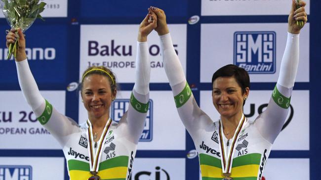 Australian team Kaarle Mcculloch, left, Anna Meares, right, pose with their medals on the podium during the Women's Team Sprint race medal ceremony at the Track Cycling World Championships in Saint-Quentin-en-Yvelines. (AP Photo/Michel Euler)