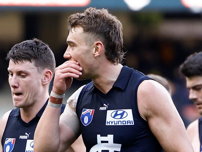 MELBOURNE, AUSTRALIA - AUGUST 11: Patrick Cripps of the Blues (right) looks dejected after a loss during the 2024 AFL Round 22 match between the Carlton Blues and the Hawthorn Hawks at The Melbourne Cricket Ground on August 11, 2024 in Melbourne, Australia. (Photo by Michael Willson/AFL Photos via Getty Images)