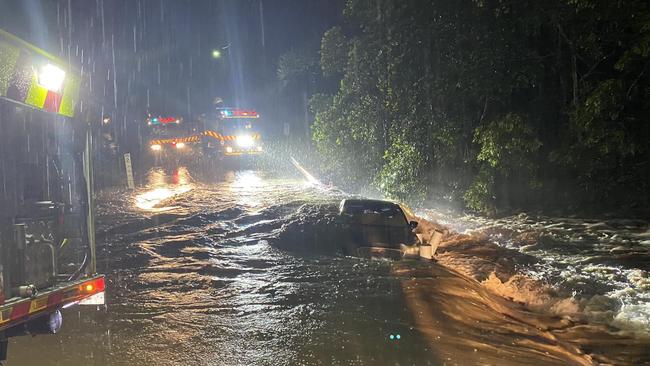 NSW Rural Fire Service firefighters from Otford and Helensburgh rescued a person trapped on the roof of their vehicle in Sydney's south. Picture: NSW RFS