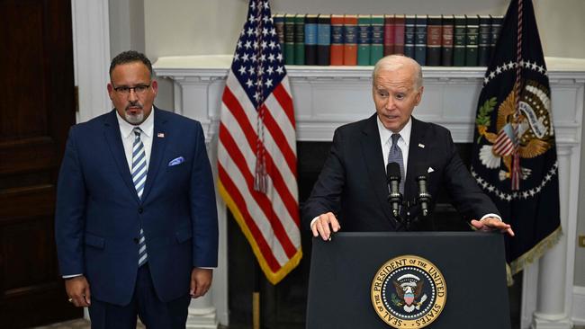 US President Joe Biden speaks about the US Supreme Court's decision overruling student debt forgiveness as Education Secretary Miguel Cardona looks on. Picture: AFP