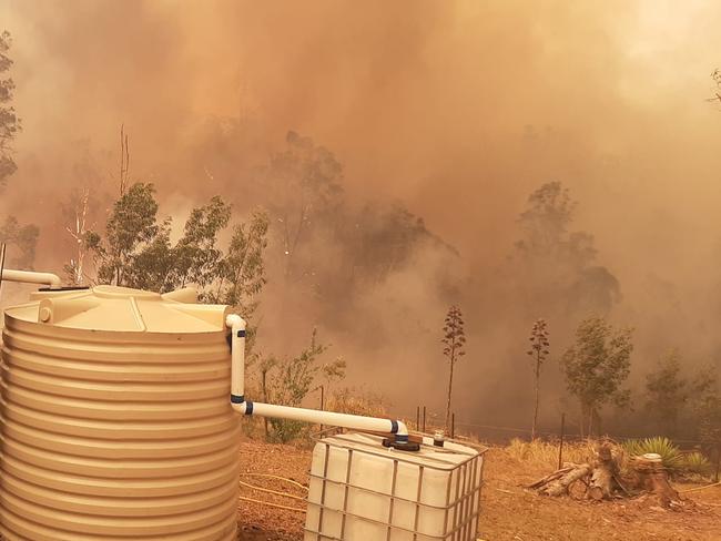 Fire approaching a home in the Kempsey area. Picture by Lindsay Rogers.