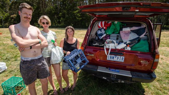 Jack Beach, Meg Carr and Emma Patrick head back to Melbourne after Falls Festival was cancelled. Picture: Jason Edwards