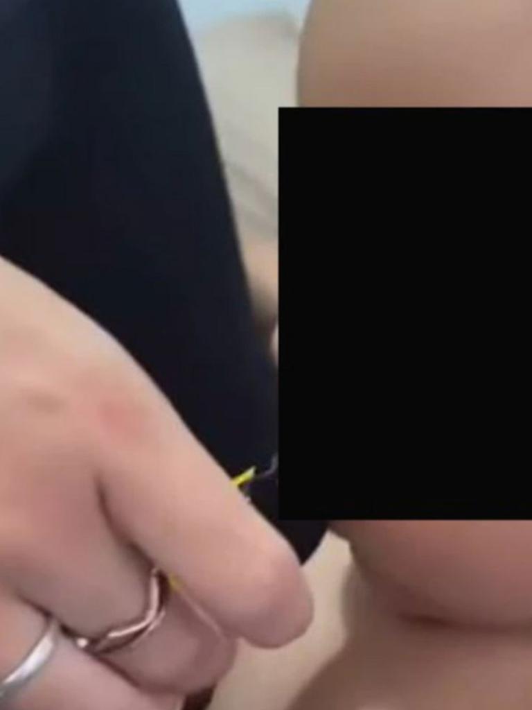 Disturbing footage shows a baby being handed a vape. Picture: Supplied