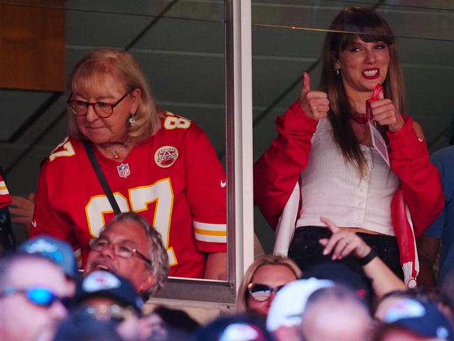 (FILES) Donna Kelce and US singer-songwriter Taylor Swift are seen during the first half of a game between the Chicago Bears and the Kansas City Chiefs at GEHA Field at Arrowhead Stadium in Kansas City, Missouri, on September 24, 2023. Another day, another Taylor Swift media circus: talk of the pop phenomenon is omnipresent, from her forthcoming concert film to her dating life to her wildly successful global tour. With hundreds of millions of social media followers and a staunchly loyal fan base, she can move any dial with the tiniest of efforts: late last month, Swift encouraged her fans to register to vote, directing them to the nonpartisan nonprofit Vote.org. The Swifties did not disappoint. (Photo by Jason Hanna / GETTY IMAGES NORTH AMERICA / AFP)