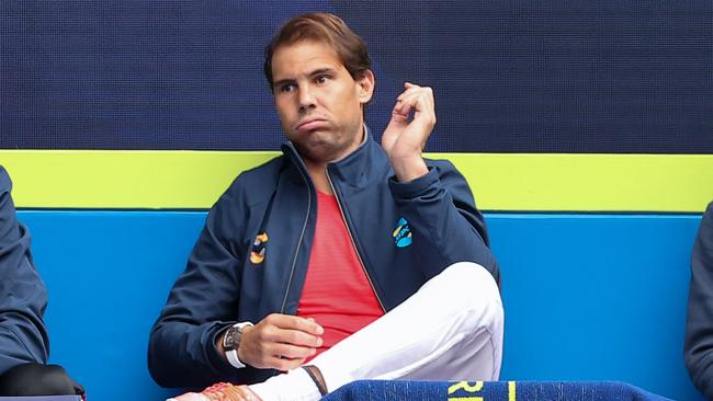 Rafael Nadal watches Pablo Carreno Busta and John Millman.